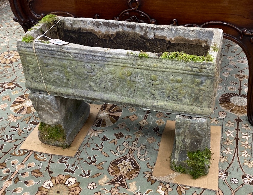 A rectangular reconstituted stone garden planter, width 64cm, depth 23cm, height 47cm